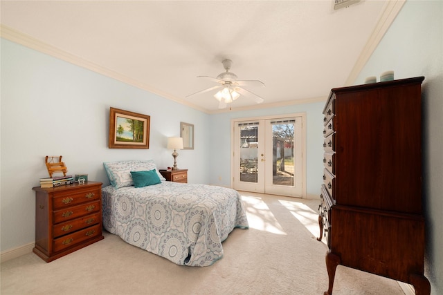 carpeted bedroom featuring ceiling fan, ornamental molding, access to outside, and french doors