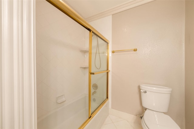 bathroom featuring tile patterned flooring, toilet, and combined bath / shower with glass door