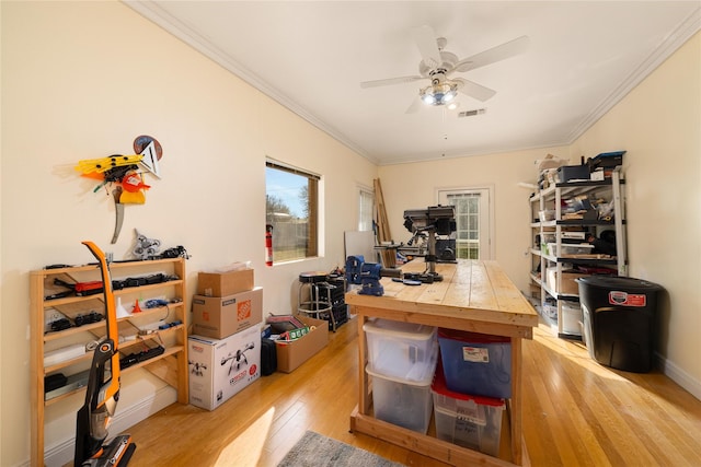 office area with ceiling fan, light hardwood / wood-style flooring, plenty of natural light, and ornamental molding