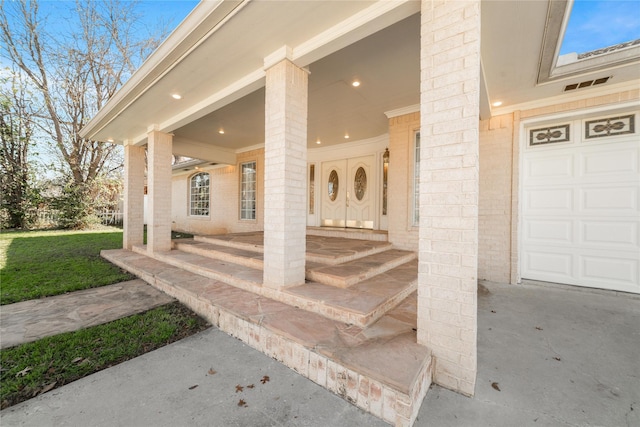 property entrance with a porch and a garage