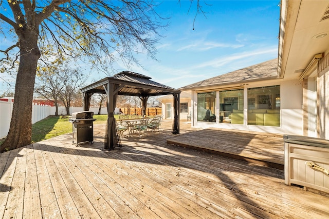 deck with a gazebo and area for grilling