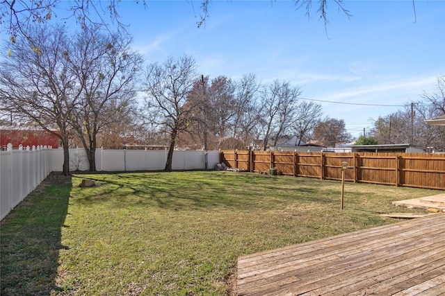 view of yard featuring a wooden deck