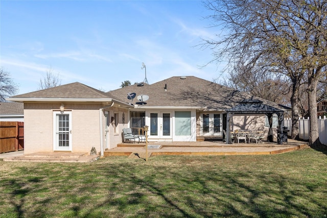 rear view of property with a gazebo, a yard, a patio, and french doors