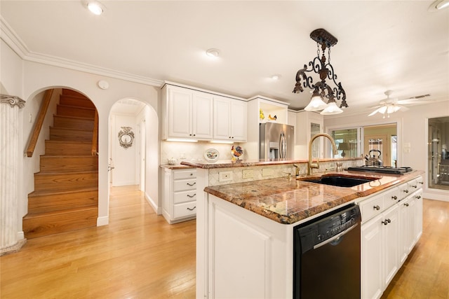 kitchen featuring dishwasher, sink, light wood-type flooring, an island with sink, and white cabinetry