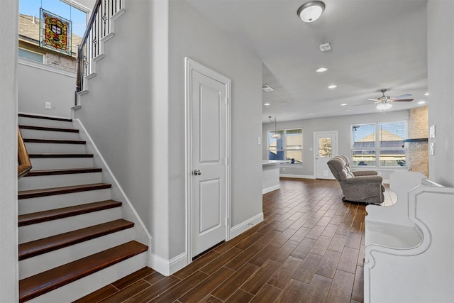 staircase with ceiling fan