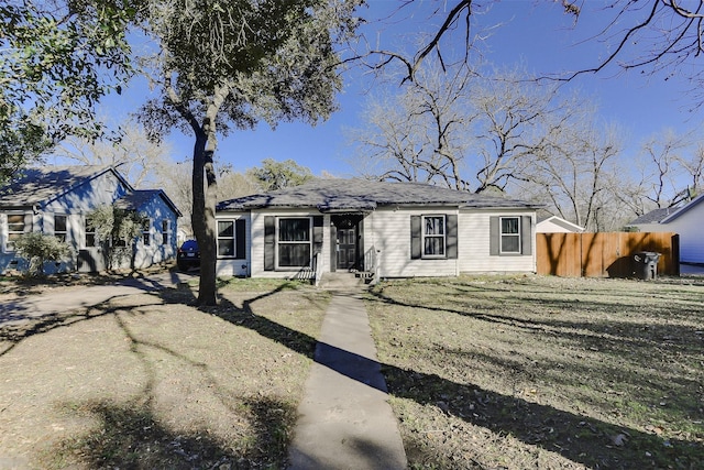 single story home with a front lawn