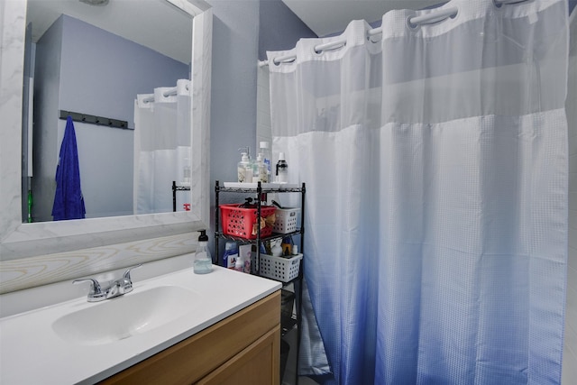 bathroom with vanity and walk in shower