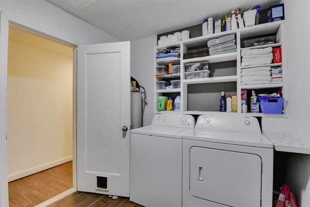 laundry room featuring washer and clothes dryer and hardwood / wood-style flooring