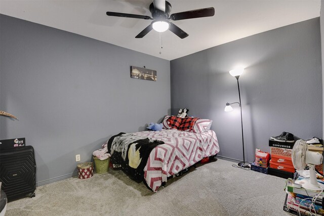 carpeted bedroom featuring ceiling fan