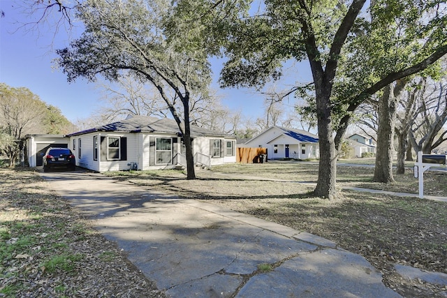 single story home featuring a garage