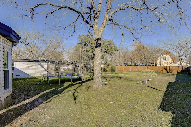 view of yard with a trampoline