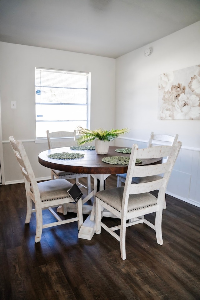 dining area featuring dark wood-type flooring