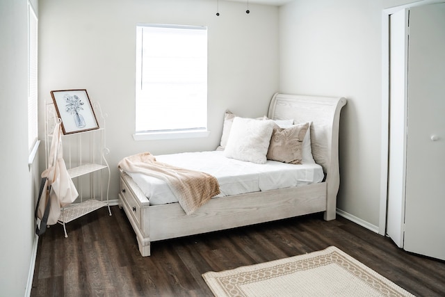 bedroom featuring dark hardwood / wood-style flooring