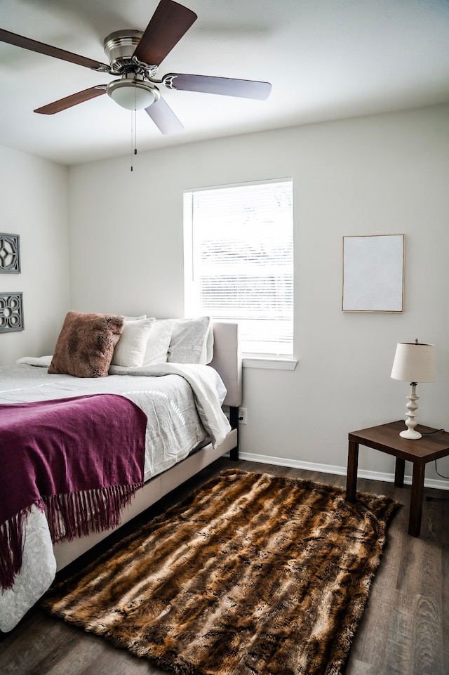 bedroom featuring dark hardwood / wood-style flooring and ceiling fan