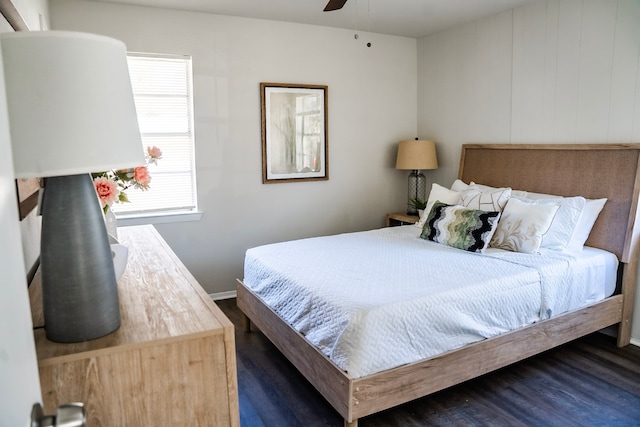 bedroom featuring ceiling fan and dark wood-type flooring