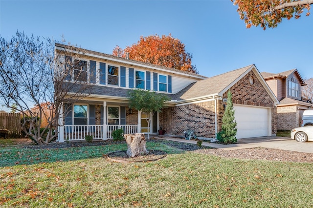 front of property with a porch, a garage, and a front lawn