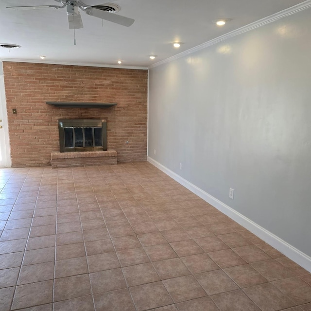 unfurnished living room with light tile patterned flooring, crown molding, brick wall, and a brick fireplace