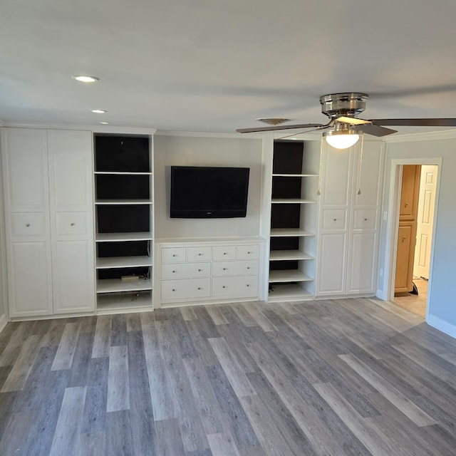 unfurnished bedroom with ceiling fan, light hardwood / wood-style flooring, and crown molding