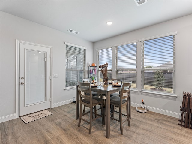 dining area with light hardwood / wood-style floors