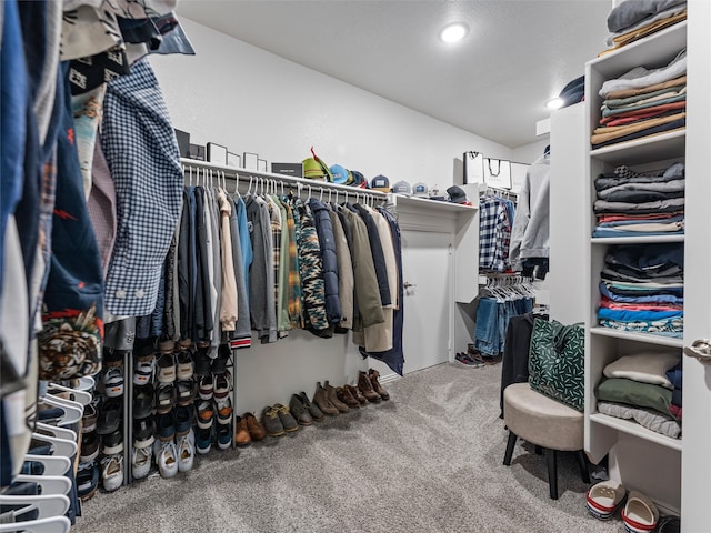 walk in closet featuring carpet