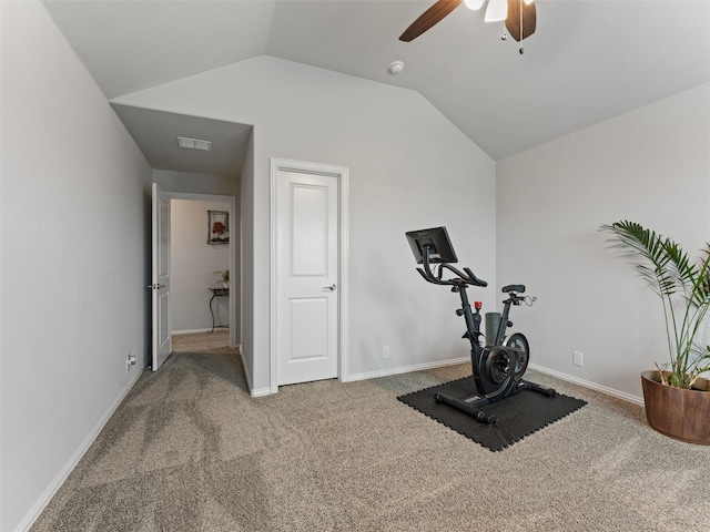 exercise room with carpet, vaulted ceiling, and ceiling fan