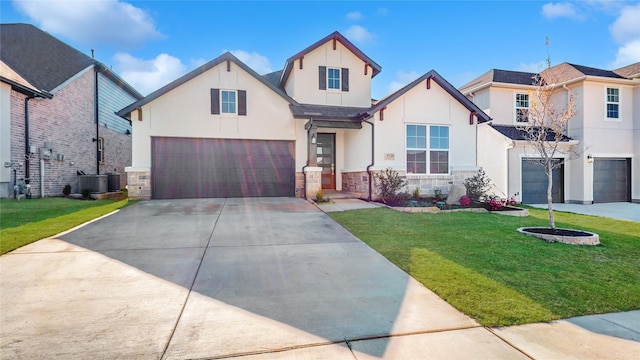 view of front of house featuring a garage, a front lawn, and cooling unit