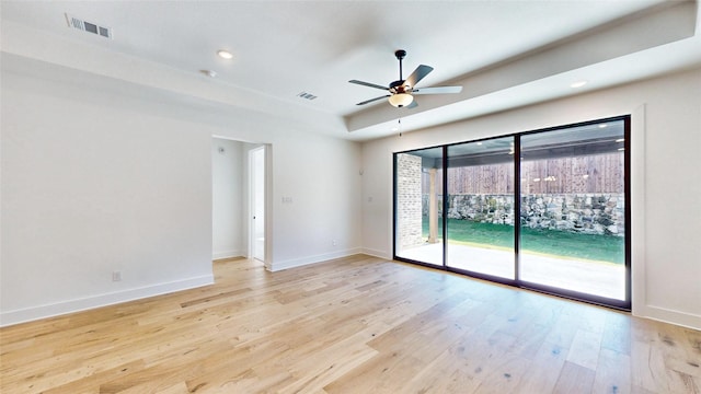 spare room featuring ceiling fan and light hardwood / wood-style floors