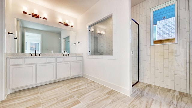 bathroom featuring vanity and a shower with shower door