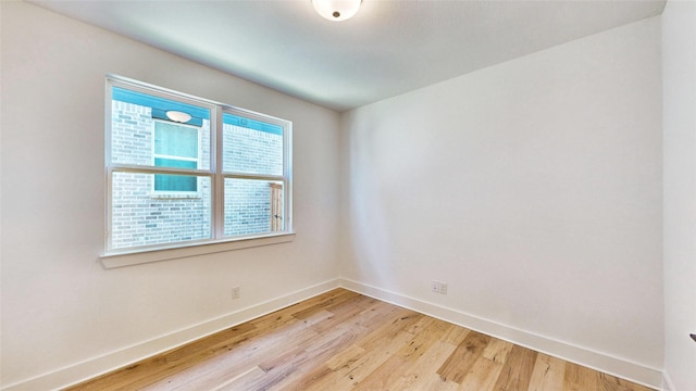 empty room with light wood-type flooring