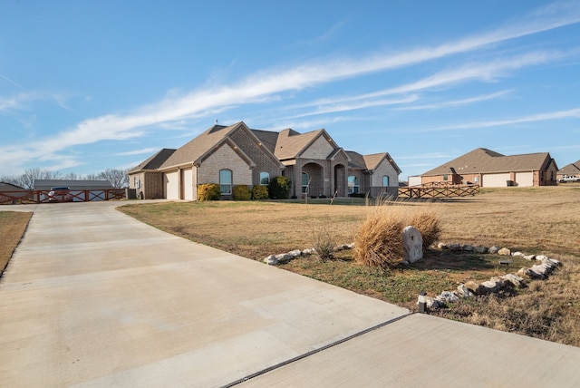 view of front of property with a front lawn and a garage