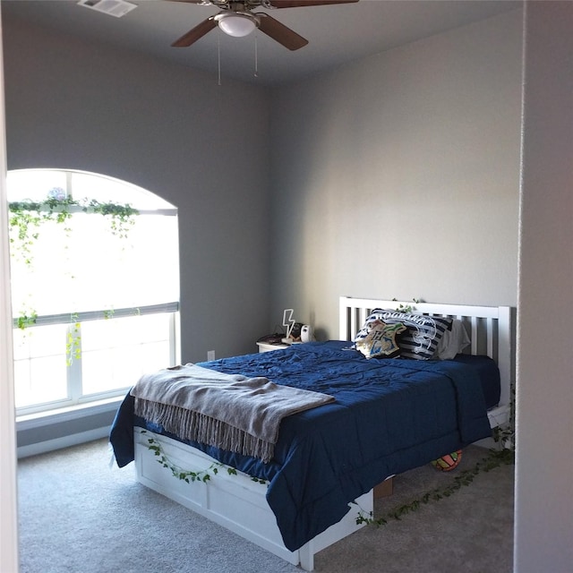 carpeted bedroom featuring ceiling fan