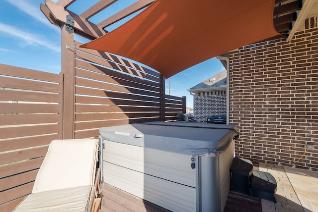 view of patio with a hot tub