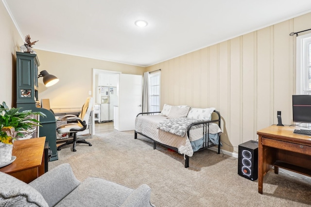 bedroom featuring carpet flooring and white refrigerator with ice dispenser