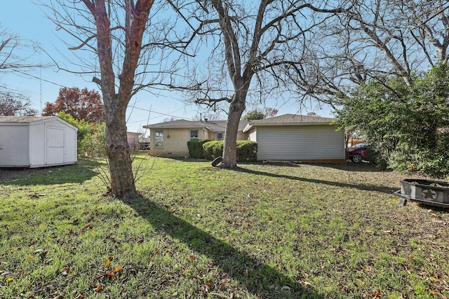 view of yard featuring a storage unit