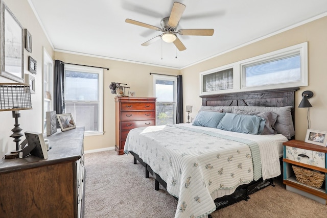 bedroom with ornamental molding, light colored carpet, and ceiling fan