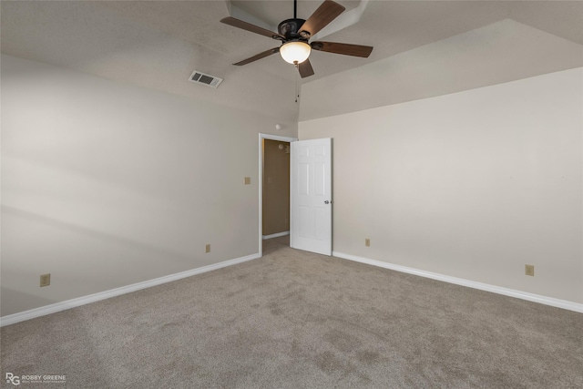 carpeted spare room with lofted ceiling and ceiling fan