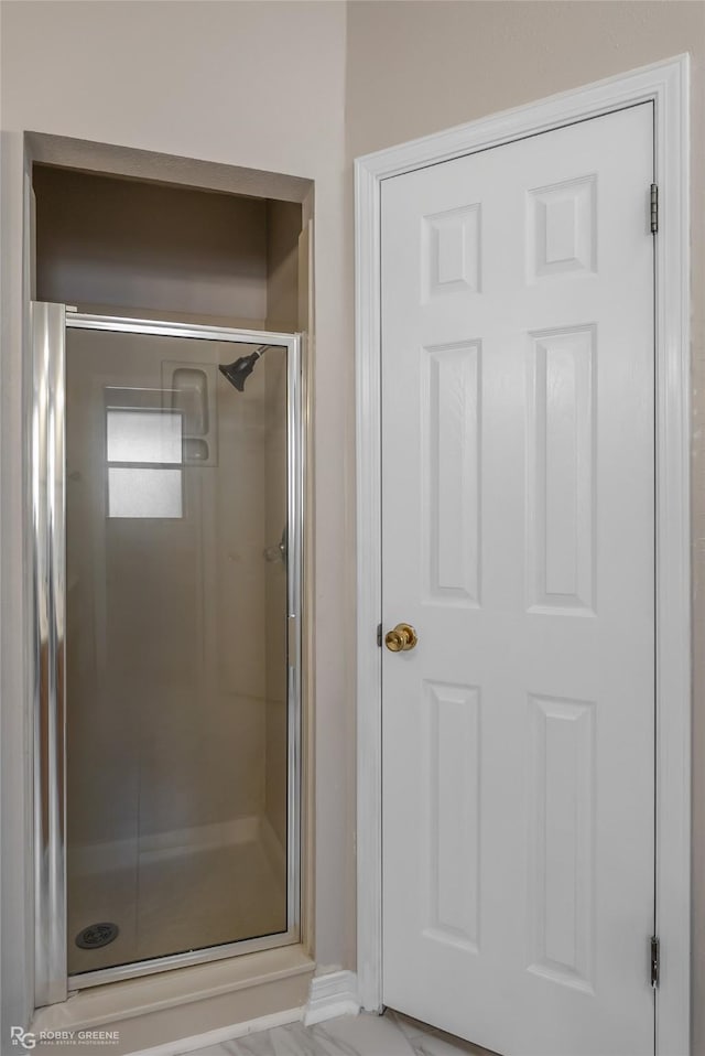 bathroom featuring an enclosed shower