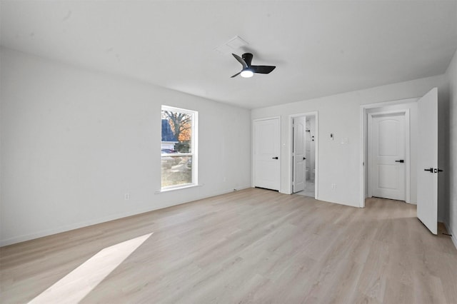 unfurnished bedroom featuring ensuite bath, light hardwood / wood-style flooring, and ceiling fan