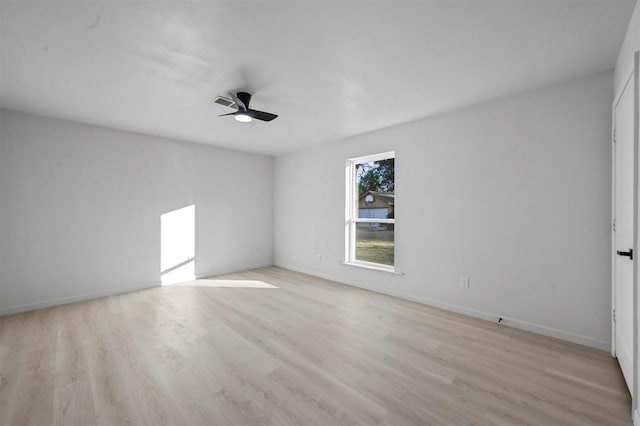 spare room featuring ceiling fan and light wood-type flooring