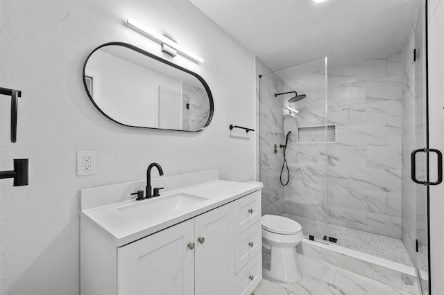 bathroom with vanity, toilet, and walk in shower