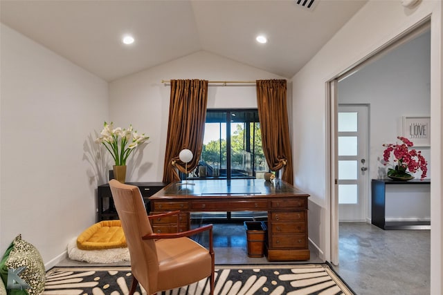 home office featuring concrete flooring and lofted ceiling