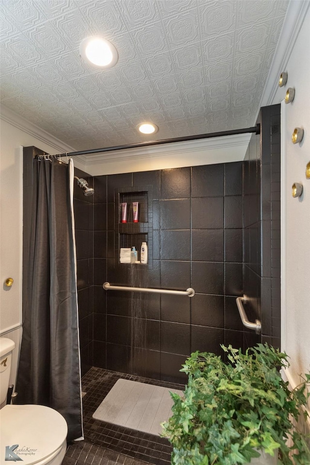 bathroom featuring tile patterned flooring, toilet, ornamental molding, and walk in shower