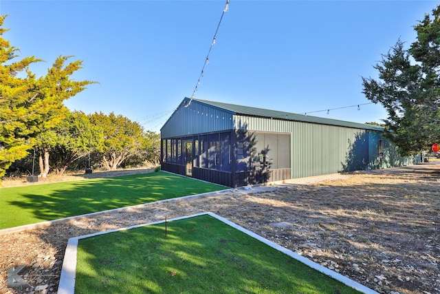 view of home's exterior with a lawn