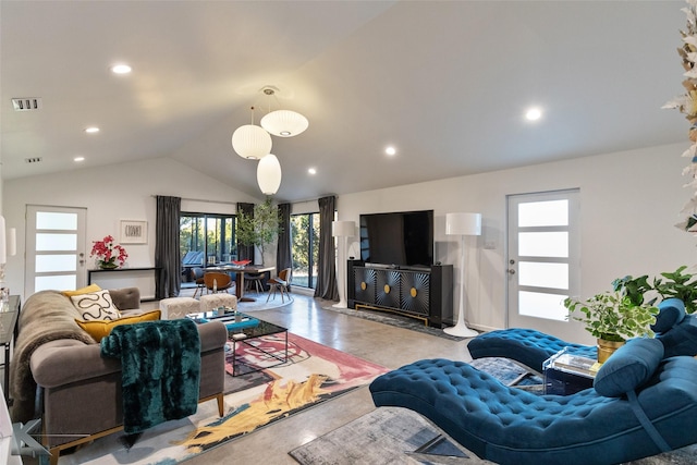 living room featuring plenty of natural light and lofted ceiling