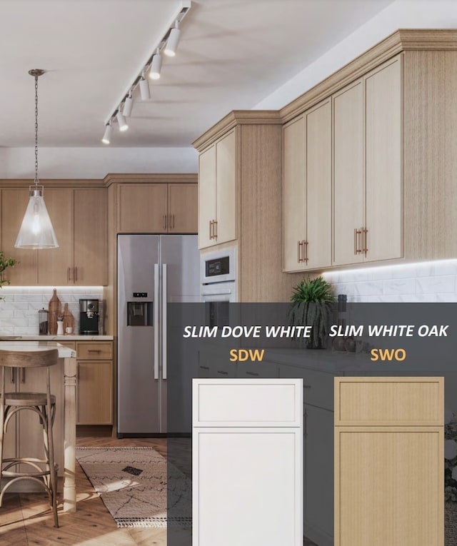 kitchen featuring stainless steel refrigerator with ice dispenser, backsplash, light brown cabinetry, light hardwood / wood-style floors, and hanging light fixtures