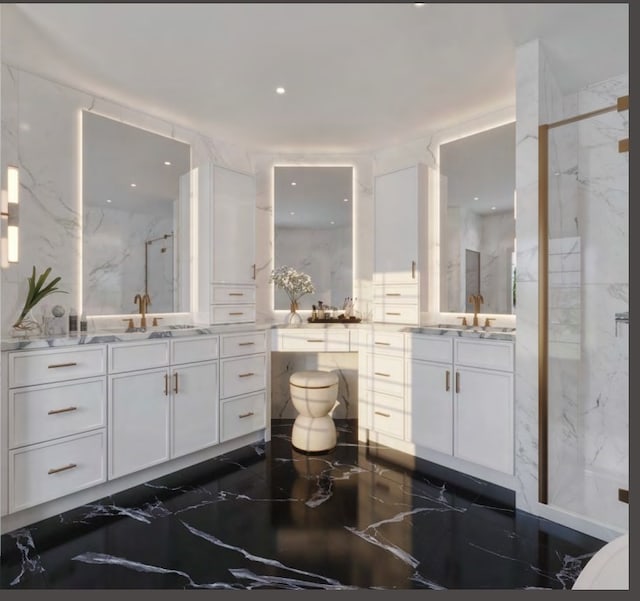 bathroom with vanity and a shower with shower door