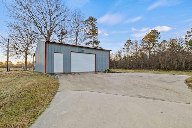 garage featuring a lawn