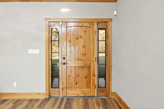 doorway to outside featuring hardwood / wood-style flooring