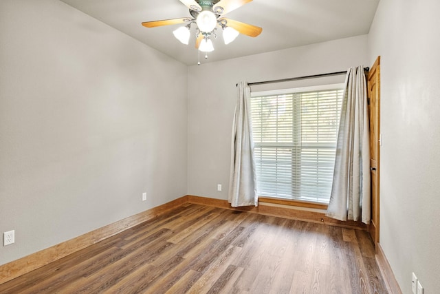 unfurnished room featuring hardwood / wood-style flooring and ceiling fan