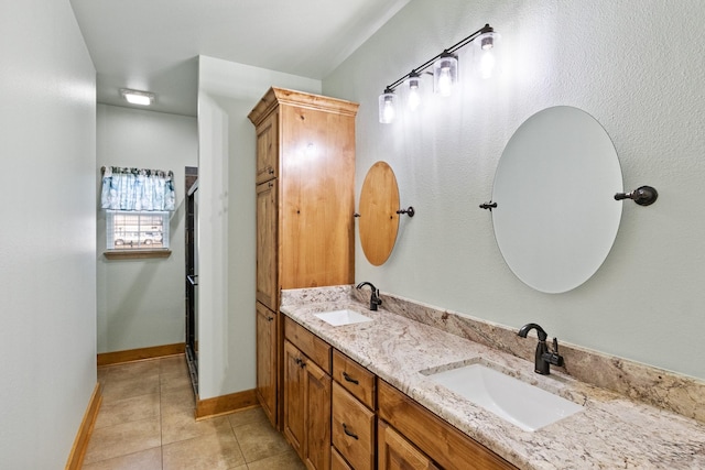 bathroom with tile patterned flooring and vanity